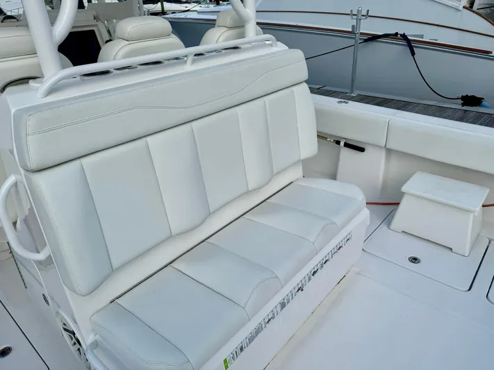 Lulu Yacht Photos Pics Invincible 35 Catamaran 2020, white leather seating, luxury boat interior.
