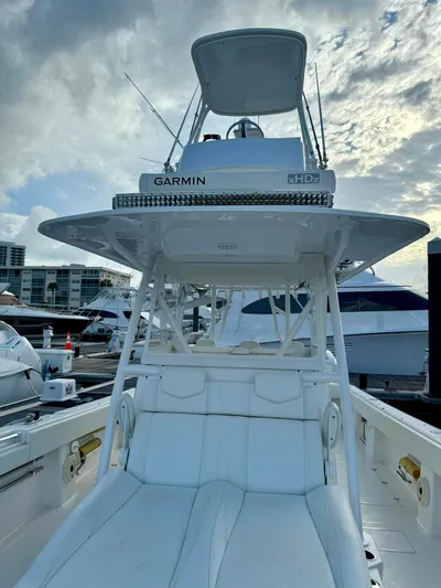 Lulu Yacht Photos Pics 2020 Invincible 35 Catamaran with Garmin electronics, docked at marina under cloudy sky.
