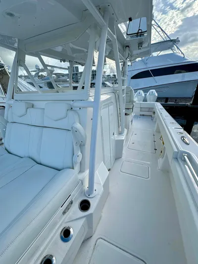 Lulu Yacht Photos Pics 2020 Invincible 35 Catamaran with sleek white interior and spacious deck.
