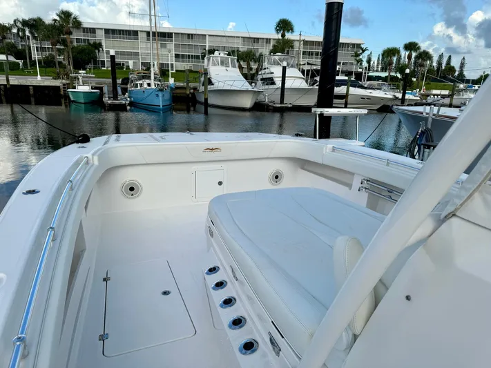 Lulu Yacht Photos Pics Invincible 35 Catamaran 2020 docked, spacious deck, marina background, clear sky.