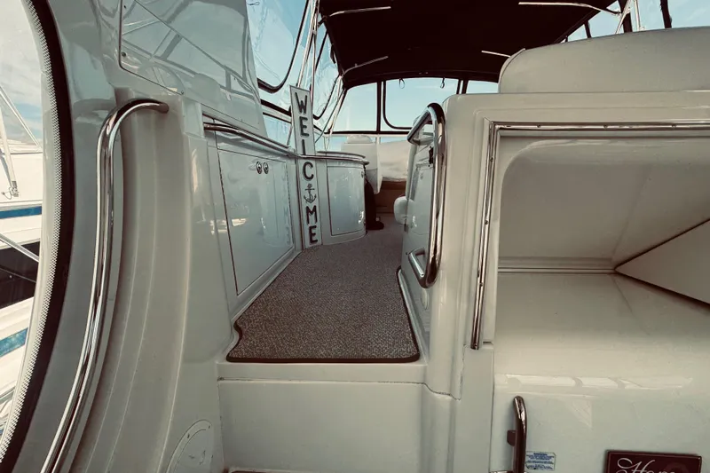 Tom’s Cruise Yacht Photos Pics Interior view of 2005 Carver 466 Motor Yacht with welcome sign and sleek design.