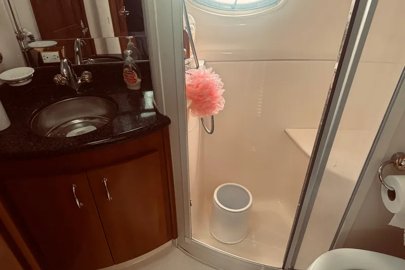 Tom’s Cruise Yacht Photos Pics Bathroom interior of 2005 Carver 466 Motor Yacht with sink and shower.