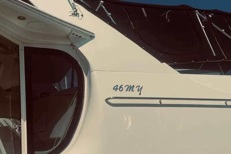 Tom’s Cruise Yacht Photos Pics 2005 Carver 466 Motor Yacht exterior with "46MY" marking, showcasing sleek design.