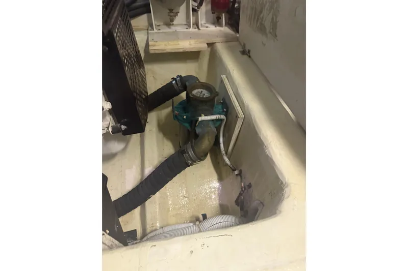 Tom’s Cruise Yacht Photos Pics Engine compartment of 2005 Carver 466 Motor Yacht showing hoses and mechanical components.