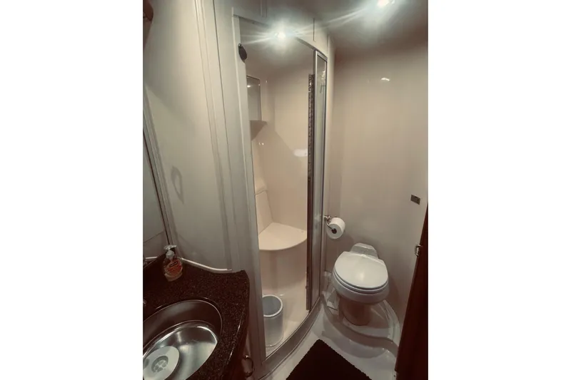 Tom&rsquo;s Cruise Yacht Photos Pics Bathroom interior of 2005 Carver 466 Motor Yacht with shower and toilet.