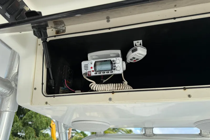 Overdraft Yacht Photos Pics 2005 Boston Whaler 320 Outrage electronics compartment with radio and control panel.