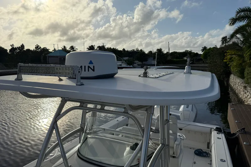 Overdraft Yacht Photos Pics 2005 Boston Whaler 320 Outrage boat docked, featuring radar equipment and clear skies.