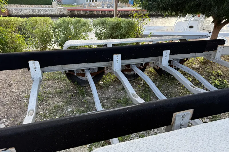 Overdraft Yacht Photos Pics Boat trailer for 2005 Boston Whaler 320 Outrage, parked near waterfront.