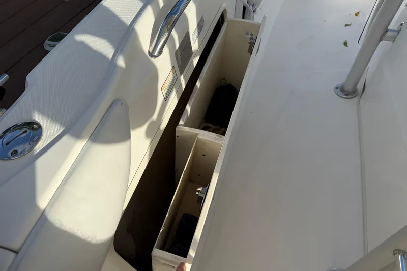 Overdraft Yacht Photos Pics Storage compartment on a 2005 Boston Whaler 320 Outrage boat deck.
