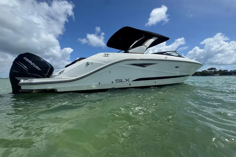  Yacht Photos Pics 2017 Sea Ray SLX 310 Outboard boat on water under blue sky.