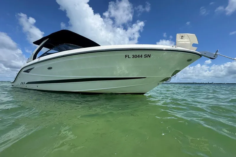 Yacht Photos Pics 2017 Sea Ray SLX 310 Outboard boat on clear water under blue sky.