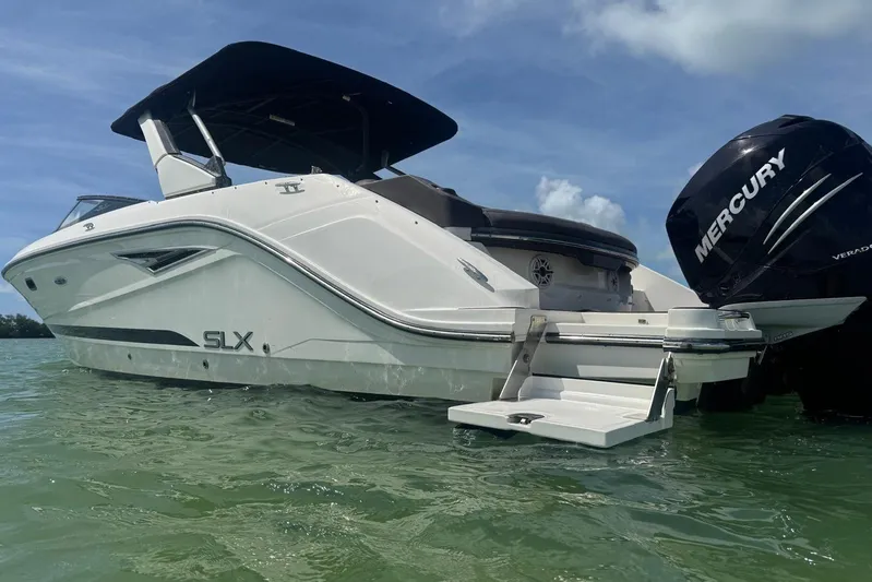  Yacht Photos Pics 2017 Sea Ray SLX 310 Outboard boat with Mercury engine on calm water.