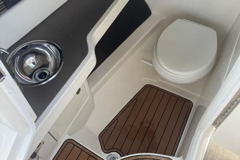  Yacht Photos Pics 2017 Sea Ray SLX 310 Outboard boat bathroom with sink and toilet.