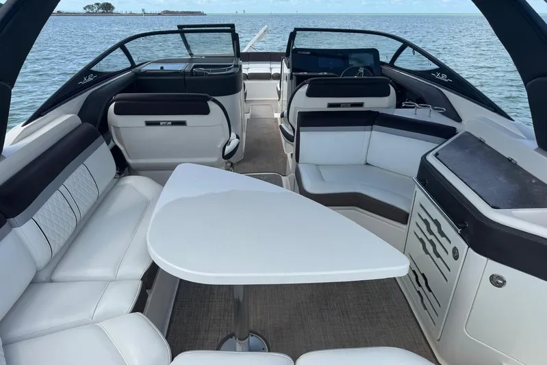  Yacht Photos Pics Luxurious 2017 Sea Ray SLX 310 Outboard boat interior with elegant seating and table.