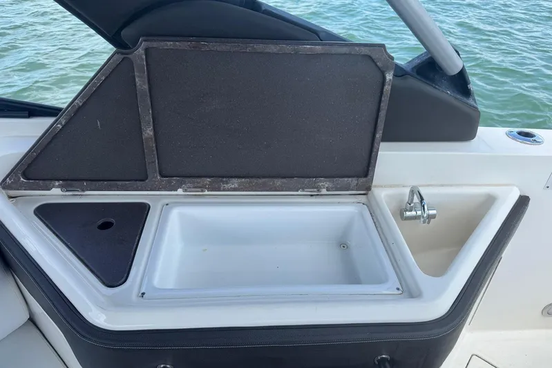  Yacht Photos Pics 2017 Sea Ray SLX 310 Outboard boat sink and storage area by the water.