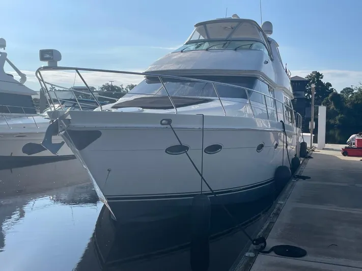 Seas The Day Yacht Photos Pics 2006 Carver 56 Voyager yacht docked at marina, side view.