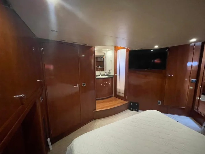 Seas The Day Yacht Photos Pics Luxurious interior of 2006 Carver 56 Voyager yacht with wood paneling and modern amenities.