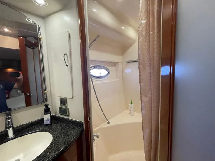Seas The Day Yacht Photos Pics Bathroom interior of 2006 Carver 56 Voyager yacht with sink and shower.