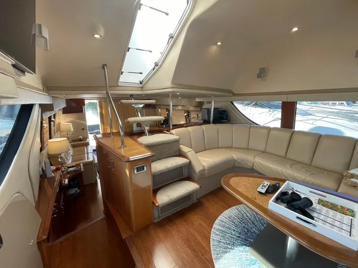 Seas The Day Yacht Photos Pics Luxurious interior of 2006 Carver 56 Voyager yacht with plush seating and modern amenities.