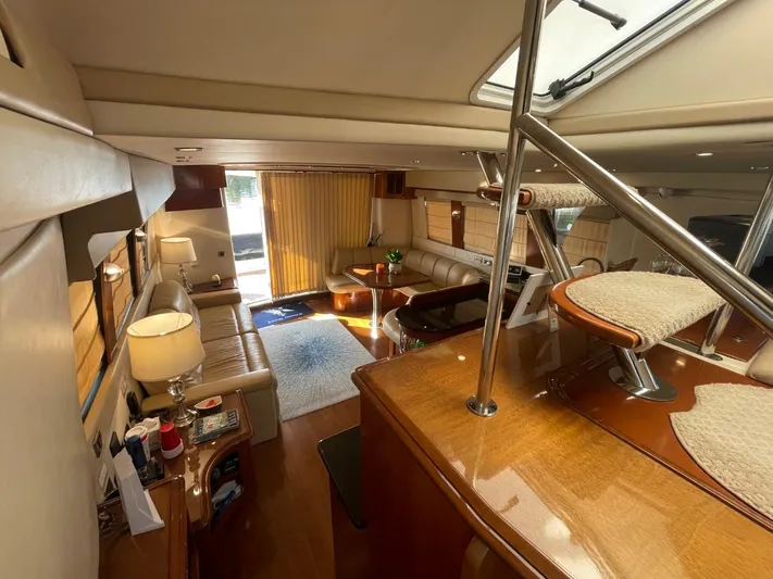 Seas The Day Yacht Photos Pics Luxurious interior of a 2006 Carver 56 Voyager yacht, featuring elegant seating and modern decor.