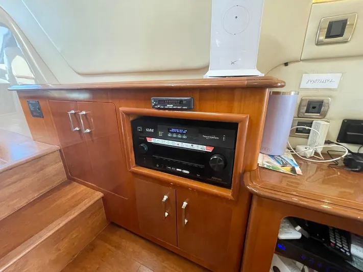Seas The Day Yacht Photos Pics Interior of 2006 Carver 56 Voyager yacht with wooden cabinetry and audio equipment.