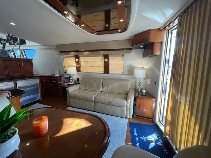 Seas The Day Yacht Photos Pics Luxurious interior of a 2006 Carver 56 Voyager yacht with elegant furnishings.