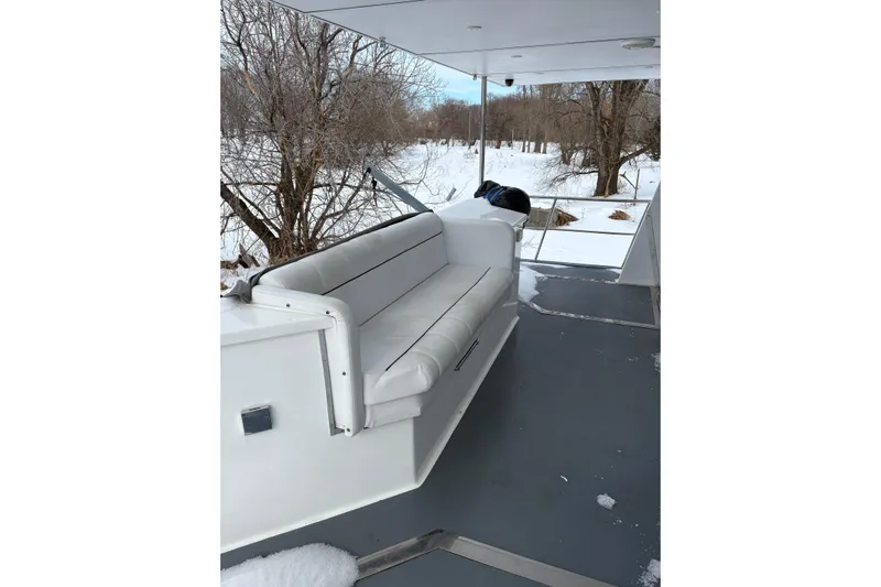 Merjo 6 Yacht Photos Pics White seating on ARTISANAL Ml-50 boat, snowy landscape in background, 2014 model.