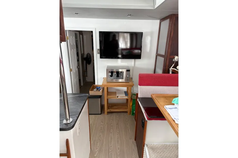 Merjo 6 Yacht Photos Pics Interior of ARTISANAL Ml-50, 2014 model, featuring a TV, microwave, and modern decor.