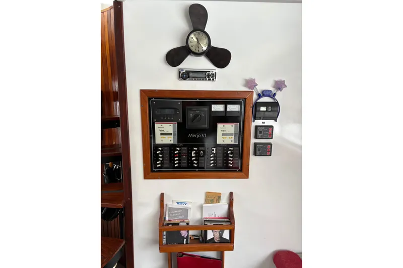 Merjo 6 Yacht Photos Pics Electrical control panel with clock and storage on a boat, ARTISANAL Ml-50, 2014 model.