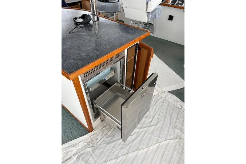 Merjo 6 Yacht Photos Pics Open drawer in Artisanal Ml-50, 2014 model, with countertop and headphones.