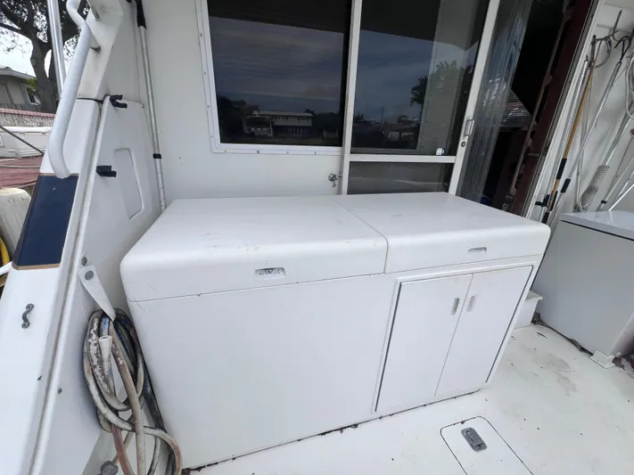 " A La Mer " Yacht Photos Pics 1988 Bertram 43 Convertible boat deck with storage cabinets.