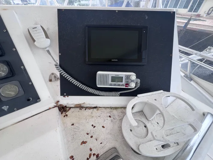 " A La Mer " Yacht Photos Pics Control panel of a 1988 Bertram 43 Convertible boat with radio and monitor.