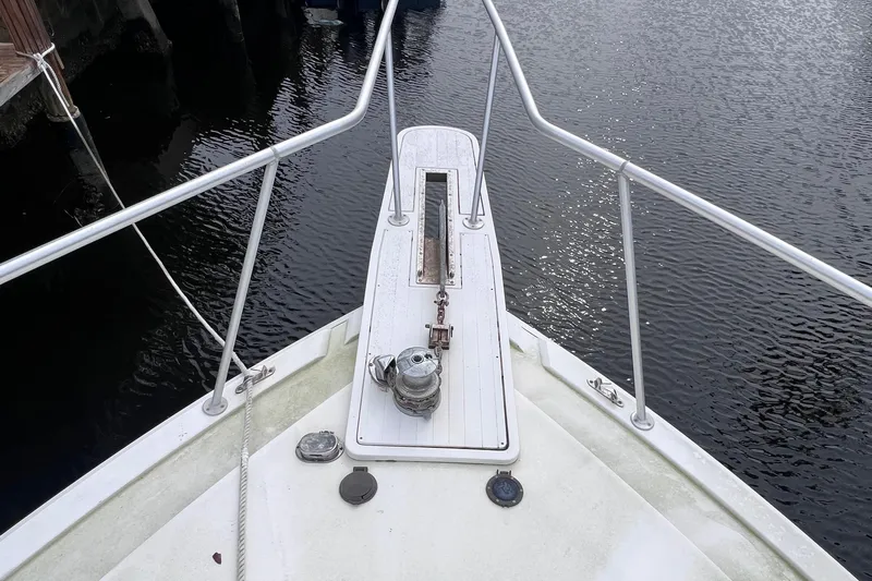 " A La Mer " Yacht Photos Pics Bow of a 1988 Bertram 43 Convertible yacht with anchor and railing.