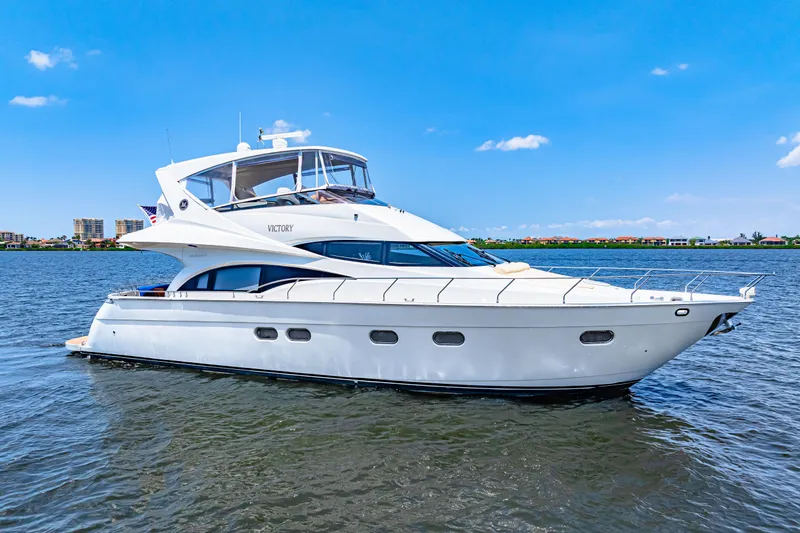 Victory Yacht Photos Pics Luxury 2005 Marquis 59 yacht cruising on a sunny day.