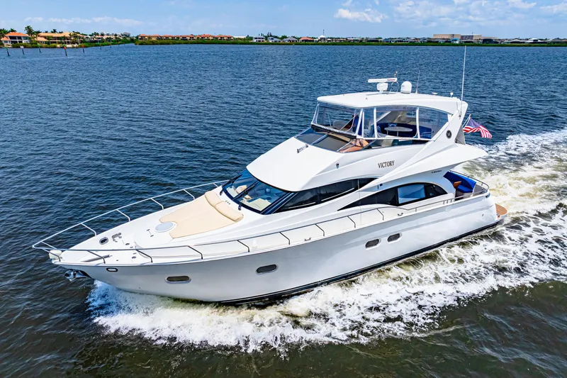 Victory Yacht Photos Pics 2005 Marquis 59 yacht cruising on open water under a clear sky.