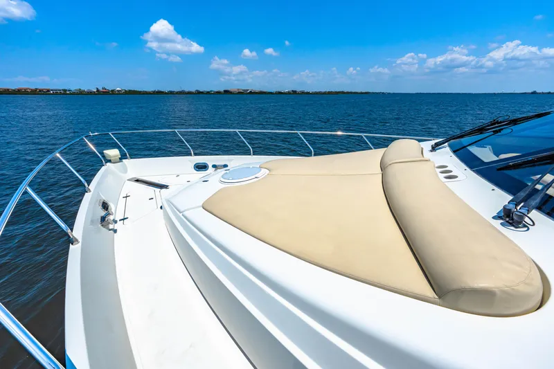 Victory Yacht Photos Pics Luxury Marquis 59 yacht deck, 2005 model, cruising on a sunny day with clear blue skies.
