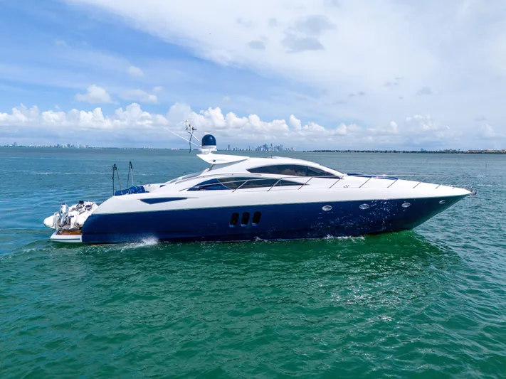  Yacht Photos Pics 2006 Sunseeker Predator 72 yacht cruising on open water under a clear sky.