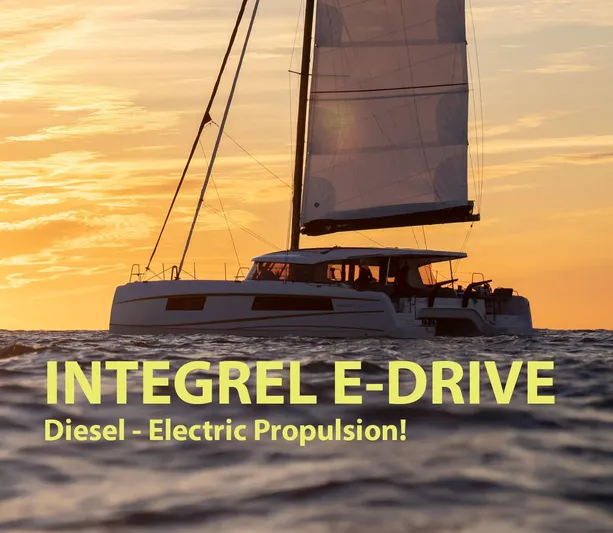  Yacht Photos Pics Sailing catamaran Nautitech 48 at sunset, featuring Integrel E-Drive diesel-electric propulsion.
