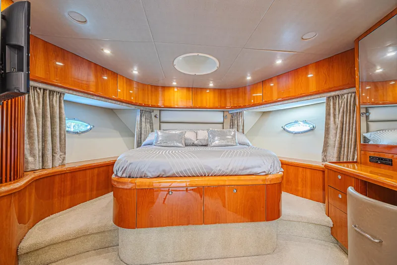 Big Chubby Xl Yacht Photos Pics Luxurious bedroom interior of 2006 Sunseeker 75 Yacht with elegant wood finish.