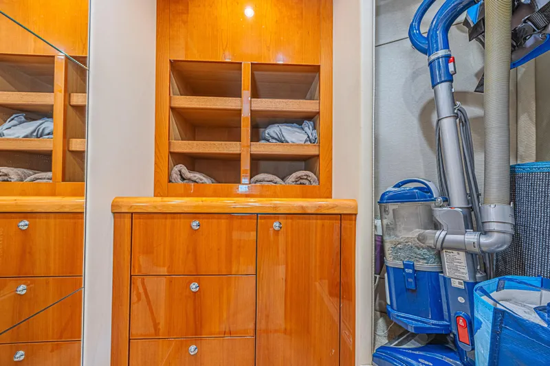 Big Chubby Xl Yacht Photos Pics Luxurious wooden cabinetry and storage area inside a 2006 Sunseeker 75 Yacht.