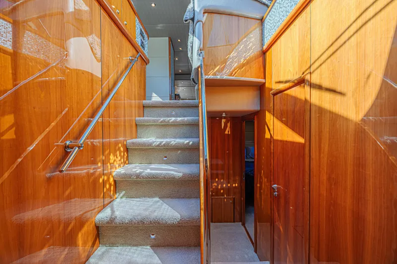 Big Chubby Xl Yacht Photos Pics Interior staircase of 2006 Sunseeker 75 Yacht with polished wood finish.