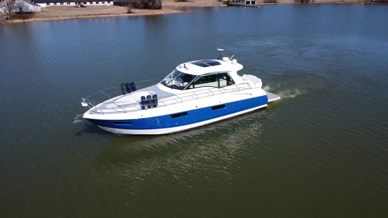 Radical Physics Yacht Photos Pics 2012 Cruisers Yachts 48 Cantius cruising on a calm lake.