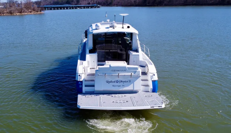 Radical Physics Yacht Photos Pics 2012 Cruisers Yachts 48 Cantius on calm water, rear view.