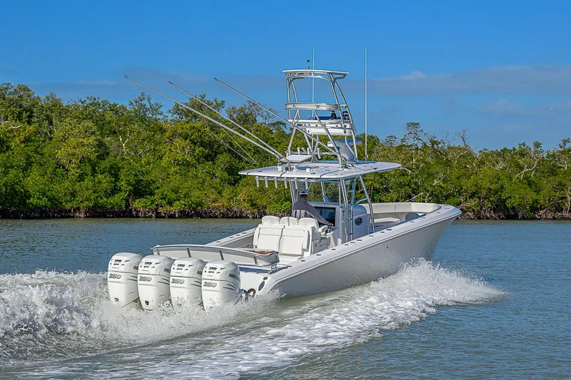 Mare Yacht Photos Pics 2019 Bahama 41 boat cruising on water with four powerful engines.