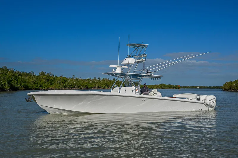Mare Yacht Photos Pics 2019 Bahama 41 boat cruising on calm waters under a clear blue sky.