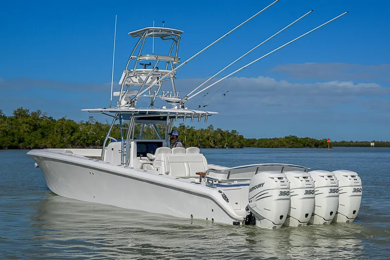 Mare Yacht Photos Pics 2019 Bahama 41 boat with four Mercury 350 engines on calm water.