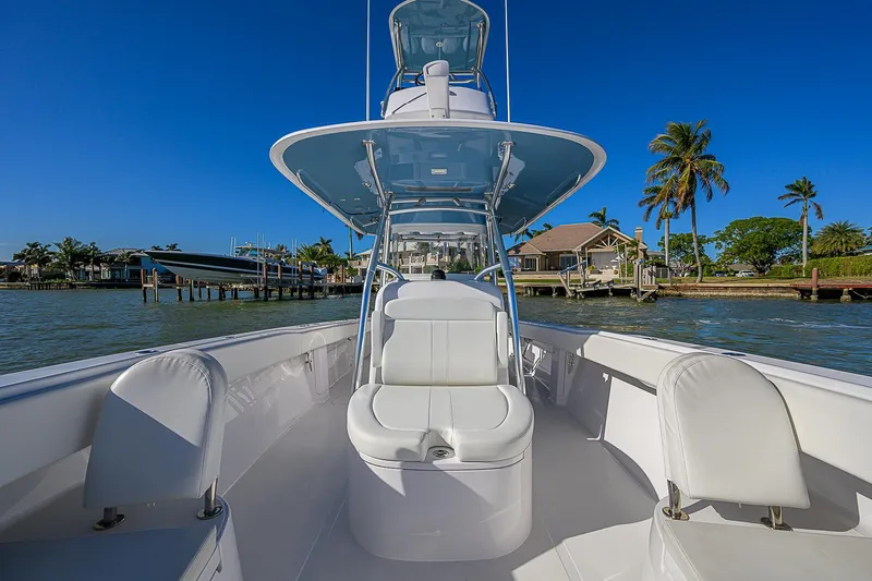 Mare Yacht Photos Pics 2019 Bahama 41 boat with sleek design, white seating, and clear blue sky backdrop.