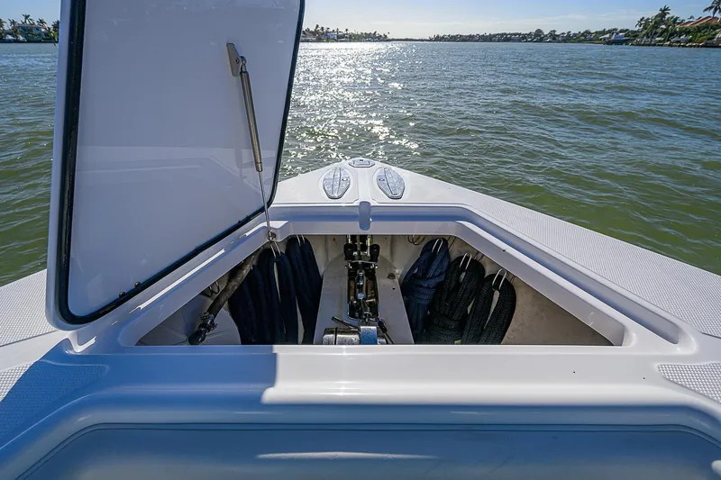 Mare Yacht Photos Pics Open storage compartment on 2019 Bahama 41 boat, overlooking calm waters.