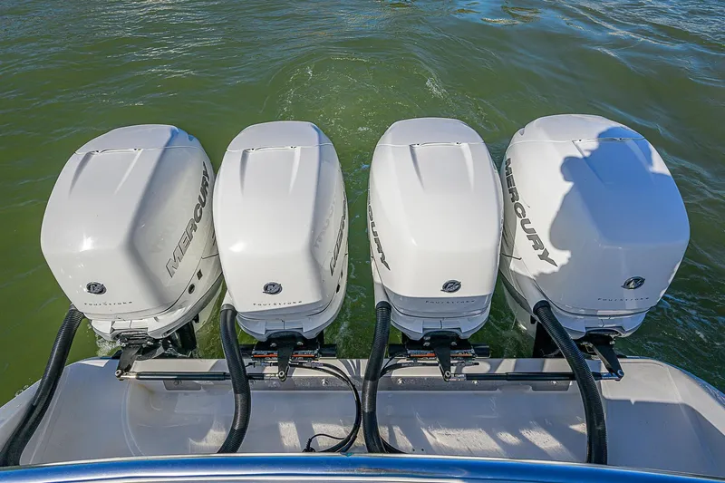 Mare Yacht Photos Pics Four Mercury outboard engines on a 2019 Bahama 41 boat, cruising on water.