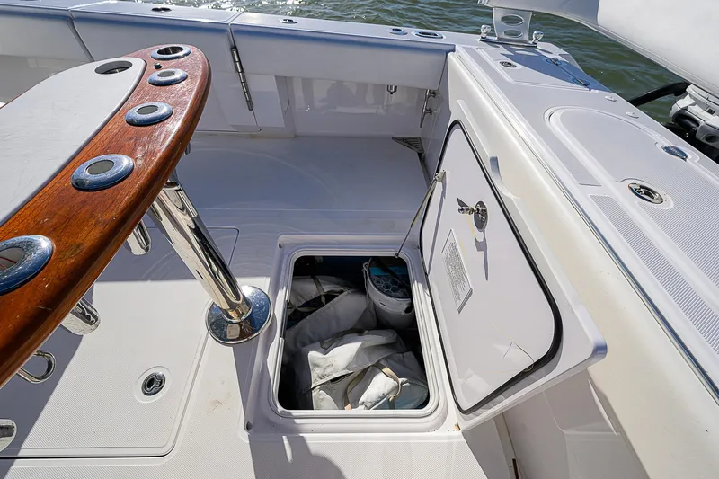 Mare Yacht Photos Pics Open storage compartment on 2019 Bahama 41 boat deck with fishing rod holders.